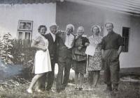 In front of the Škrabánek family house in the pasturage settlement V Háji