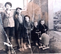 with siblings (fifth from the left)